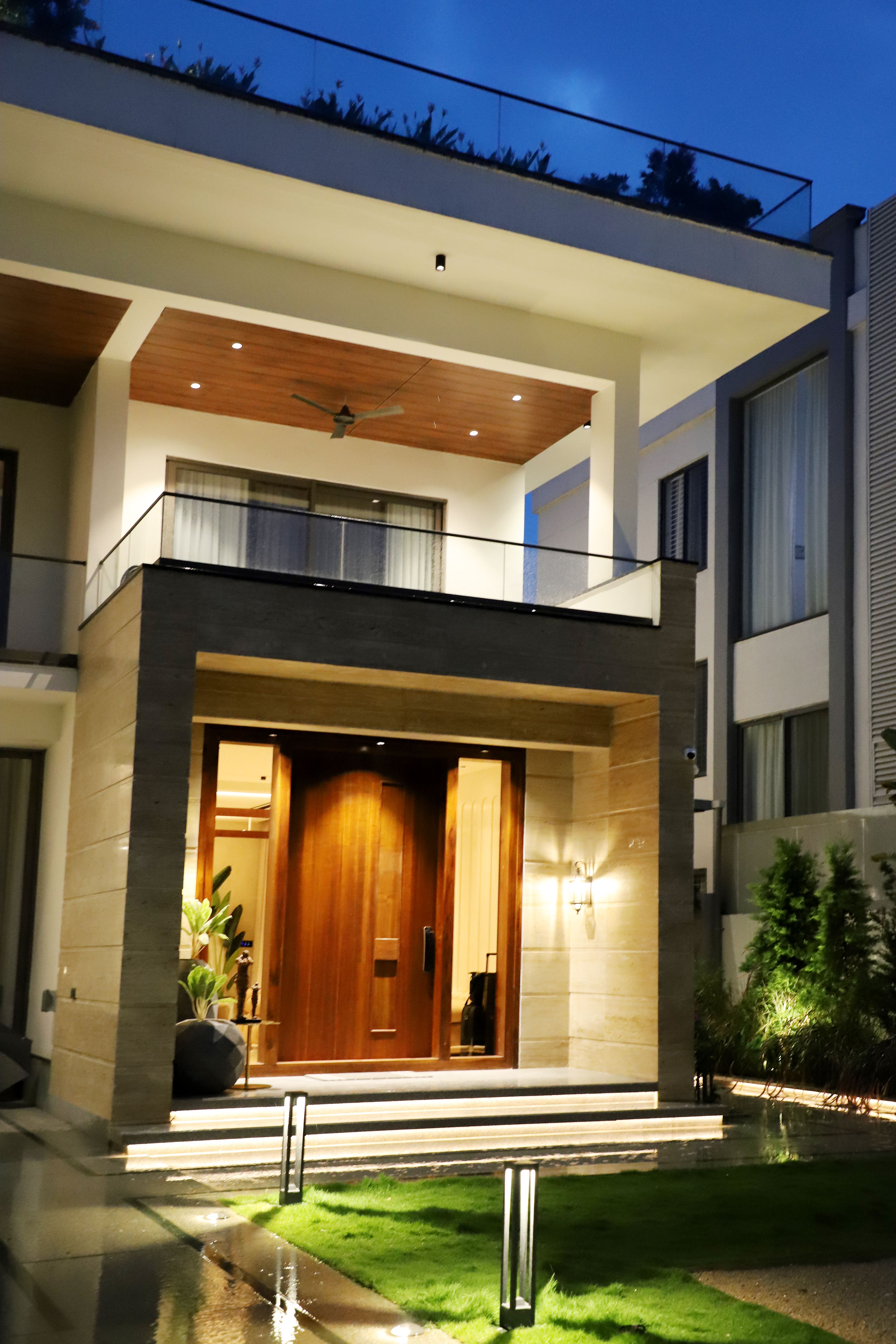Illuminated modern home entrance at night